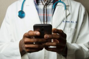 Doctor using EHR on a mobile device